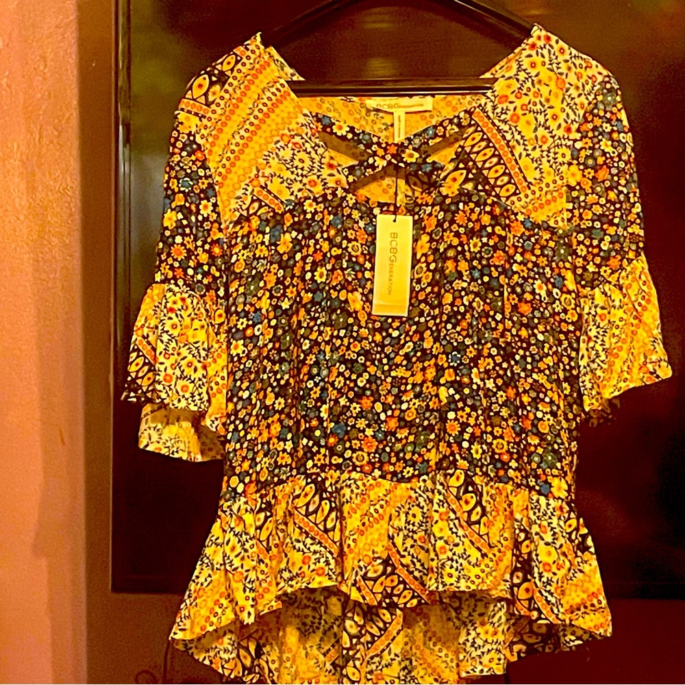 Cute multi colored BCBG top. With tag still on never worn.